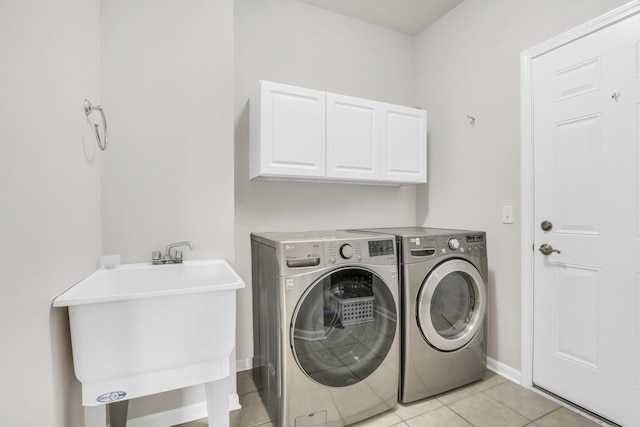 6406 Cunningham Ct, Gurnee, IL 60031 - laundry room featuring separate washer and dryer, cabinet space, and light tile patterned flooring