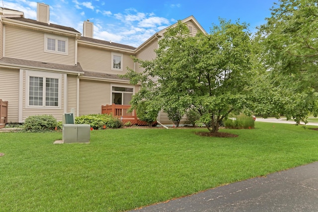 6406 Cunningham Ct, Gurnee, IL 60031 - rear view of property featuring a chimney and a lawn