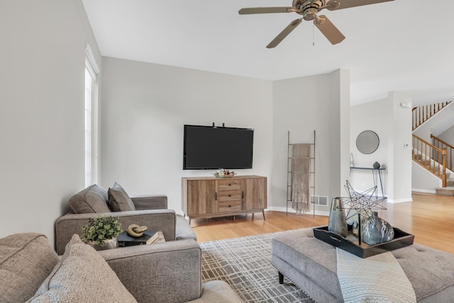 6406 Cunningham Ct, Gurnee, IL 60031 - living room featuring stairway, ceiling fan, and wood finished floors