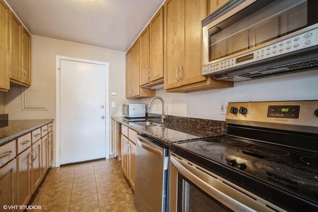 1508 W Pratt Blvd Unit 2C, Chicago, IL 60626 - kitchen with stainless steel appliances and dark stone counters
