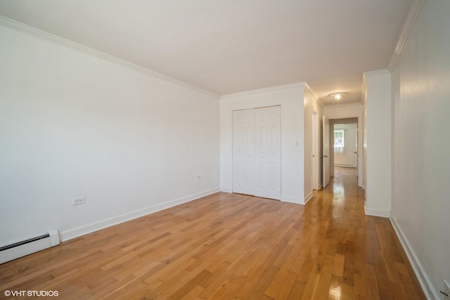 1508 W Pratt Blvd Unit 2C, Chicago, IL 60626 - spare room featuring a baseboard heating unit, light wood-style floors, and crown molding