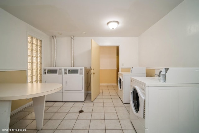 1508 W Pratt Blvd Unit 2C, Chicago, IL 60626 - community laundry with washing machine and dryer and light tile patterned flooring