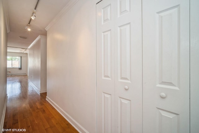 1508 W Pratt Blvd Unit 2C, Chicago, IL 60626 - hallway with rail lighting, ornamental molding, dark wood-style floors, and a baseboard heating unit