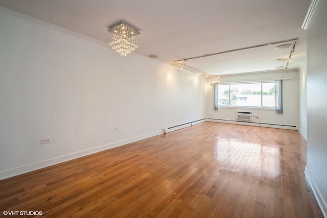 1508 W Pratt Blvd Unit 2C, Chicago, IL 60626 - spare room featuring a chandelier, hardwood / wood-style flooring, crown molding, and a wall unit AC