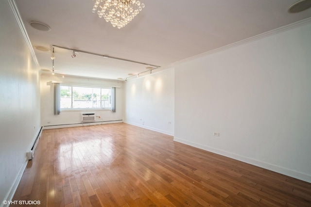1508 W Pratt Blvd Unit 2C, Chicago, IL 60626 - empty room with a baseboard heating unit, ornamental molding, rail lighting, and hardwood / wood-style flooring