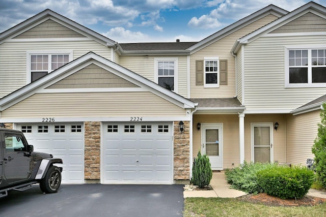 2224 Flagstone Ln Unit 2224, Carpentersville, IL 60110 - view of property featuring asphalt driveway and stone siding