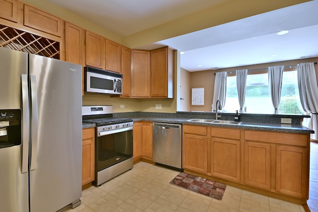 2224 Flagstone Ln Unit 2224, Carpentersville, IL 60110 - kitchen featuring stainless steel appliances, a peninsula, recessed lighting, and dark stone countertops