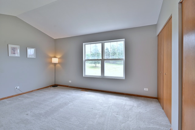 2224 Flagstone Ln Unit 2224, Carpentersville, IL 60110 - unfurnished bedroom featuring carpet floors and lofted ceiling