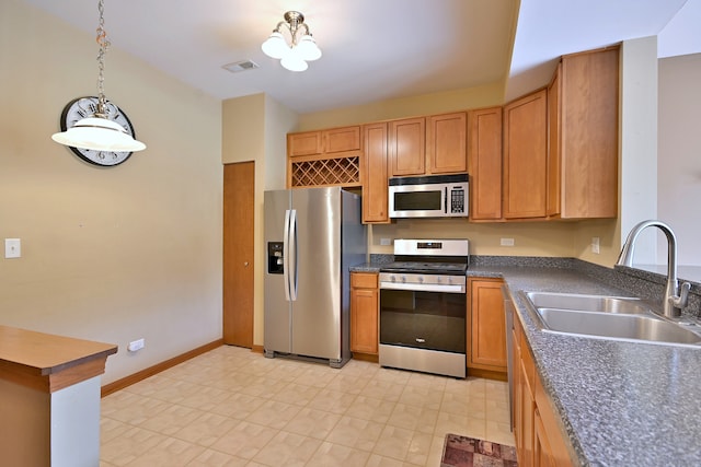 2224 Flagstone Ln Unit 2224, Carpentersville, IL 60110 - kitchen with appliances with stainless steel finishes, dark countertops, and pendant lighting