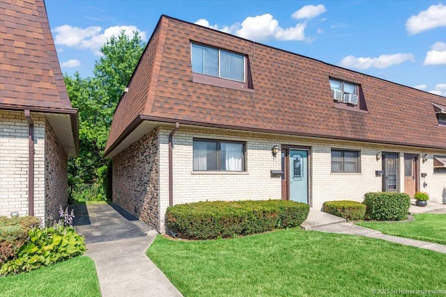 7526 S Cork Ave Unit 7526, Justice, IL 60458 - view of front of property with mansard roof, a shingled roof, a front lawn, and brick siding