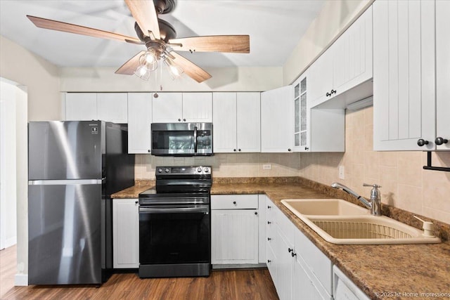 7526 S Cork Ave Unit 7526, Justice, IL 60458 - kitchen with appliances with stainless steel finishes, tasteful backsplash, and white cabinets