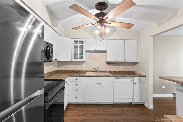 7526 S Cork Ave Unit 7526, Justice, IL 60458 - kitchen with black appliances, dark countertops, a ceiling fan, and decorative backsplash