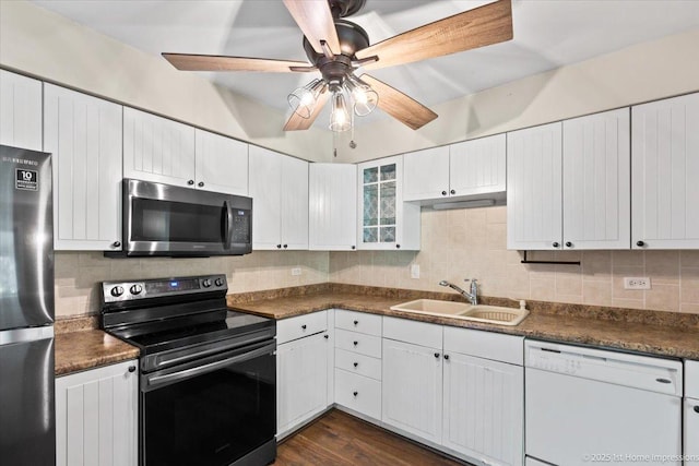 7526 S Cork Ave Unit 7526, Justice, IL 60458 - kitchen with appliances with stainless steel finishes, ceiling fan, dark countertops, tasteful backsplash, and white cabinets