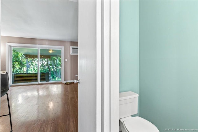 7526 S Cork Ave Unit 7526, Justice, IL 60458 - bathroom featuring wood finished floors and a wall mounted AC