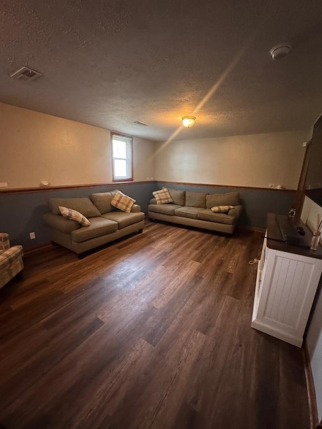 815 Arnold Ave, Rockford, IL 61108 - living room with a textured ceiling and dark wood finished floors