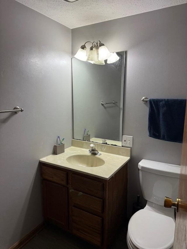 815 Arnold Ave, Rockford, IL 61108 - half bath featuring vanity and a textured ceiling