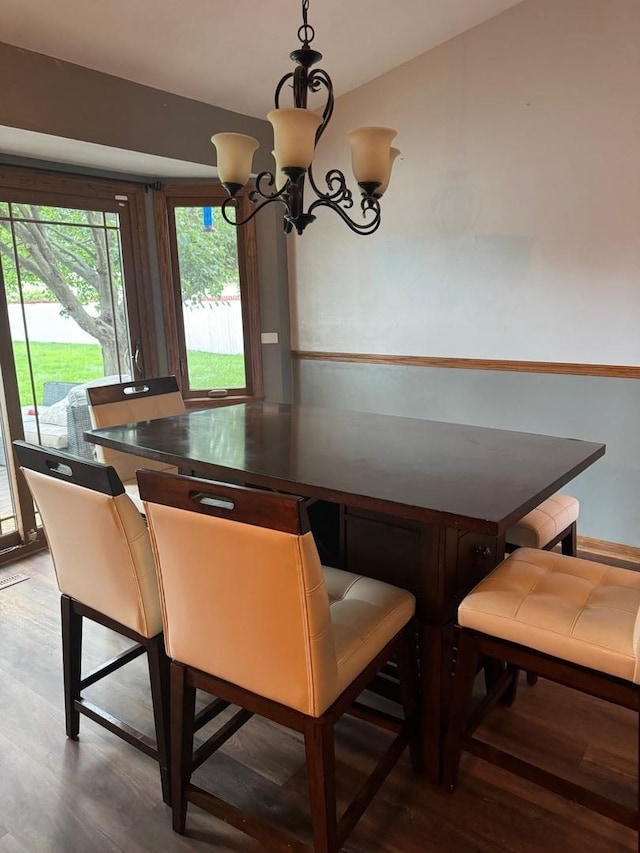 815 Arnold Ave, Rockford, IL 61108 - dining area with wood finished floors and a chandelier