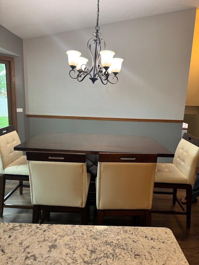 815 Arnold Ave, Rockford, IL 61108 - dining room featuring dark wood-style floors and a chandelier