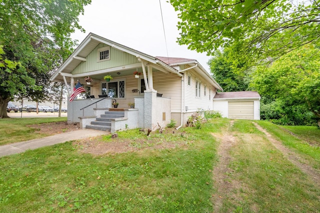 102 E Front St, Mount Morris, IL 61054 - bungalow-style home with covered porch, an outbuilding, driveway, and a garage