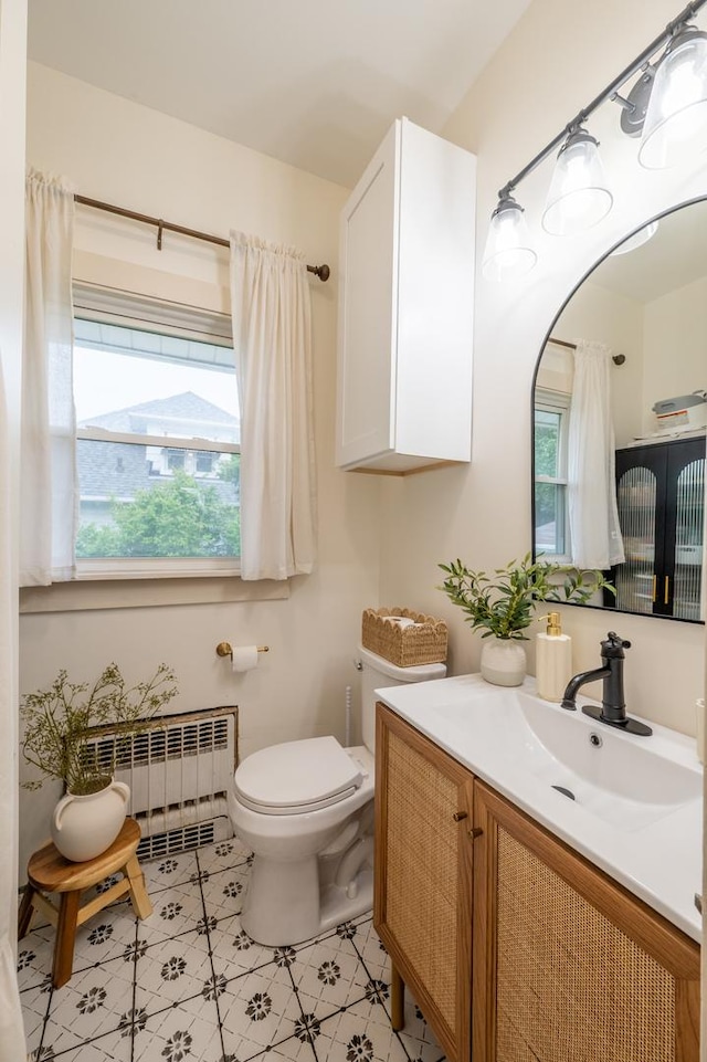 102 E Front St, Mount Morris, IL 61054 - bathroom with radiator heating unit and vanity