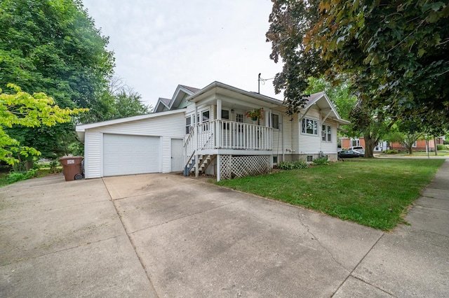 102 E Front St, Mount Morris, IL 61054 - ranch-style house with covered porch, a front lawn, driveway, a detached garage, and stairway