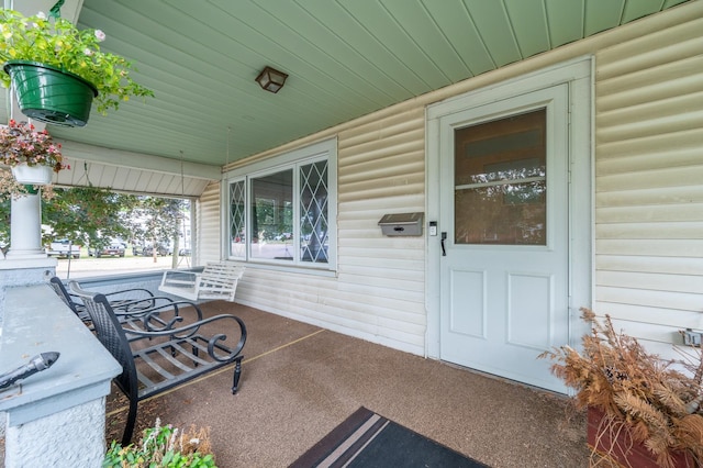 102 E Front St, Mount Morris, IL 61054 - doorway to property featuring covered porch
