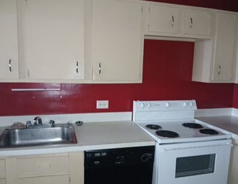 5415 N Sheridan Rd Unit 3615, Chicago, IL 60640 - kitchen with white range with electric cooktop, black dishwasher, light countertops, and white cabinetry