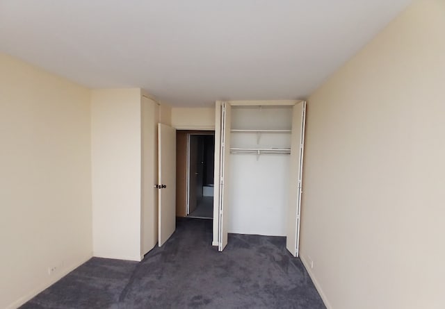 5415 N Sheridan Rd Unit 3615, Chicago, IL 60640 - unfurnished bedroom with dark carpet and a closet