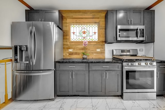 2946 W 102nd St, Evergreen Park, IL 60805 - kitchen with appliances with stainless steel finishes, dark stone counters, light marble finish floors, wooden walls, and gray cabinetry