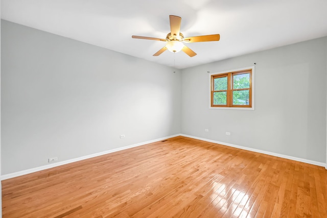 2946 W 102nd St, Evergreen Park, IL 60805 - spare room featuring light wood-type flooring and ceiling fan