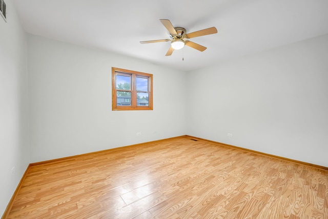 2946 W 102nd St, Evergreen Park, IL 60805 - unfurnished room with a ceiling fan and wood finished floors