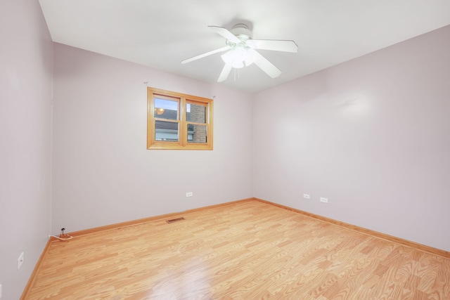 2946 W 102nd St, Evergreen Park, IL 60805 - unfurnished room featuring ceiling fan and wood finished floors