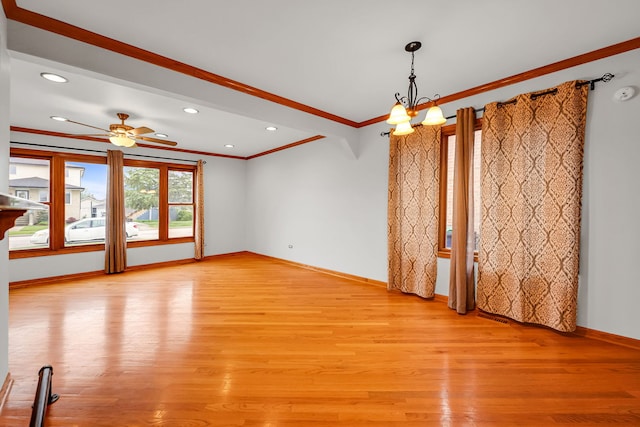 2946 W 102nd St, Evergreen Park, IL 60805 - unfurnished room with crown molding, light wood-style floors, ceiling fan, recessed lighting, and a chandelier