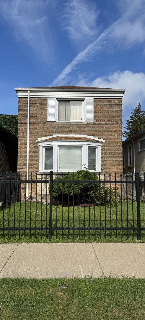 9108 S Marshfield Ave, Chicago, IL 60620 - view of front of home featuring brick siding and a fenced front yard