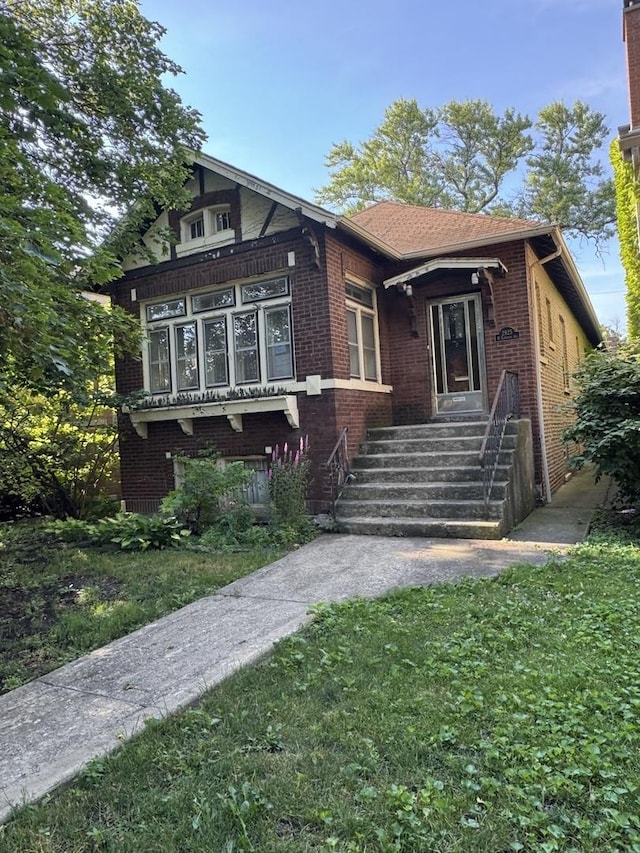 2925 W Eastwood Ave, Chicago, IL 60525 - view of front of home featuring brick siding and a front yard