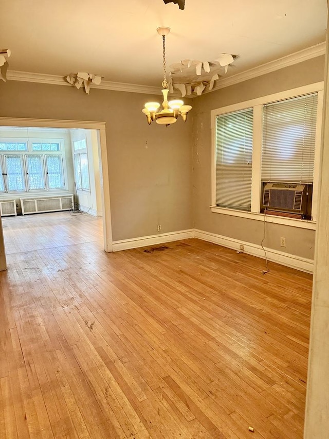 2925 W Eastwood Ave, Chicago, IL 60525 - empty room with cooling unit, a chandelier, ornamental molding, and hardwood / wood-style floors