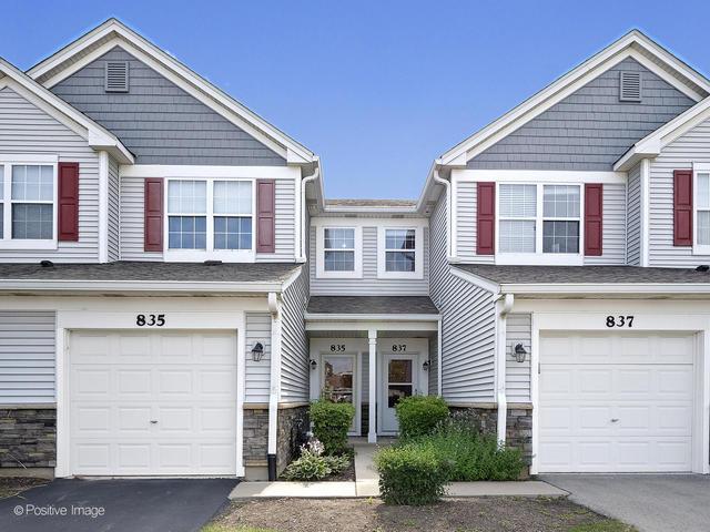 835 Genesee Dr, Naperville, IL 60563 - craftsman-style home featuring a garage, stone siding, and driveway