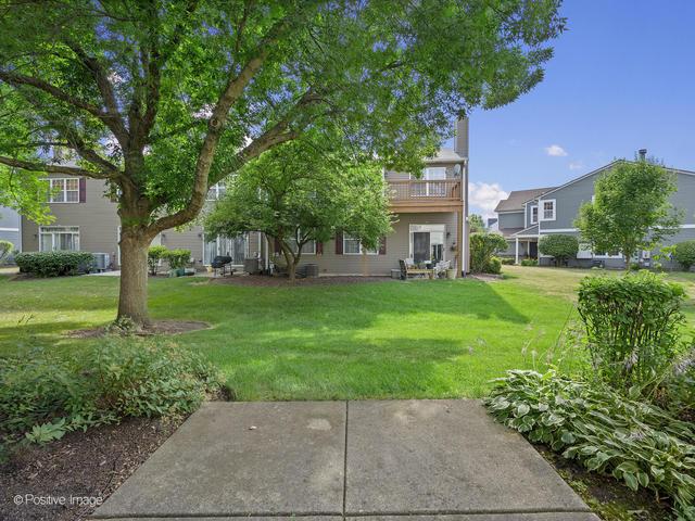 835 Genesee Dr, Naperville, IL 60563 - view of grassy yard featuring a balcony