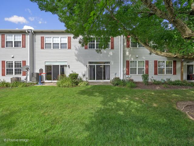 835 Genesee Dr, Naperville, IL 60563 - rear view of property with a lawn