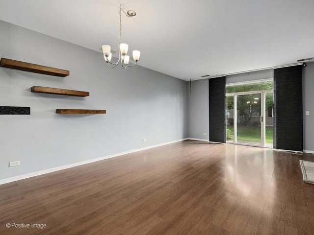 835 Genesee Dr, Naperville, IL 60563 - empty room with wood finished floors and a chandelier