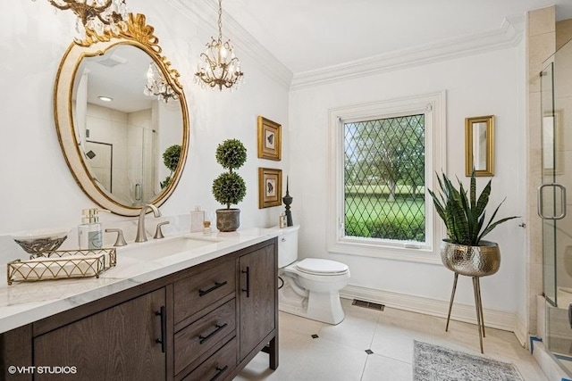 bathroom featuring vanity, a stall shower, ornamental molding, a chandelier, and tile patterned flooring