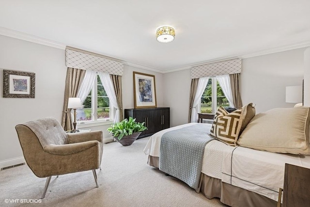 carpeted bedroom with multiple windows and ornamental molding