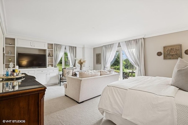 bedroom featuring ornamental molding, light carpet, and access to outside