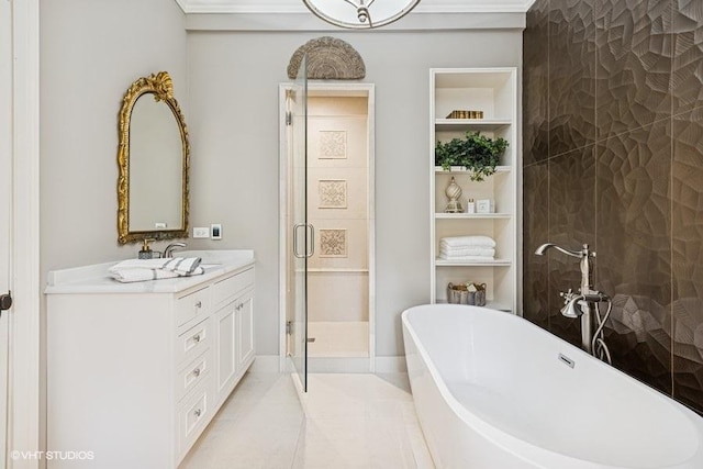 bathroom with vanity, a freestanding bath, a stall shower, built in shelves, and tile patterned floors