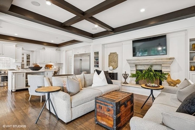 living area featuring beamed ceiling, dark wood-style floors, a premium fireplace, and recessed lighting