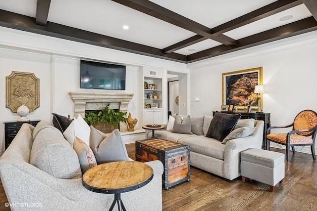 living room featuring beamed ceiling, dark wood finished floors, a fireplace, coffered ceiling, and recessed lighting
