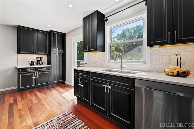 740 Lexington Ave, Saint Charles, IL 60174 - kitchen with dark cabinets, dishwasher, backsplash, light countertops, and wood finished floors