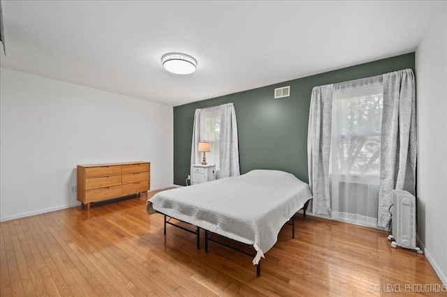 740 Lexington Ave, Saint Charles, IL 60174 - bedroom featuring radiator heating unit and hardwood / wood-style flooring