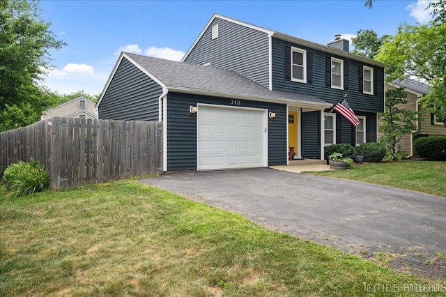 740 Lexington Ave, Saint Charles, IL 60174 - view of front of property featuring a chimney, driveway, and a garage