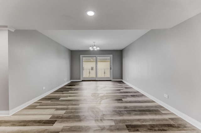 5721 Circle Dr Unit 202, Oak Lawn, IL 60453 - unfurnished room featuring a chandelier and wood finished floors
